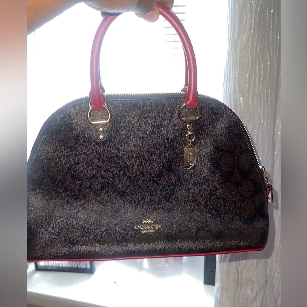 Chocolate and red coach purse